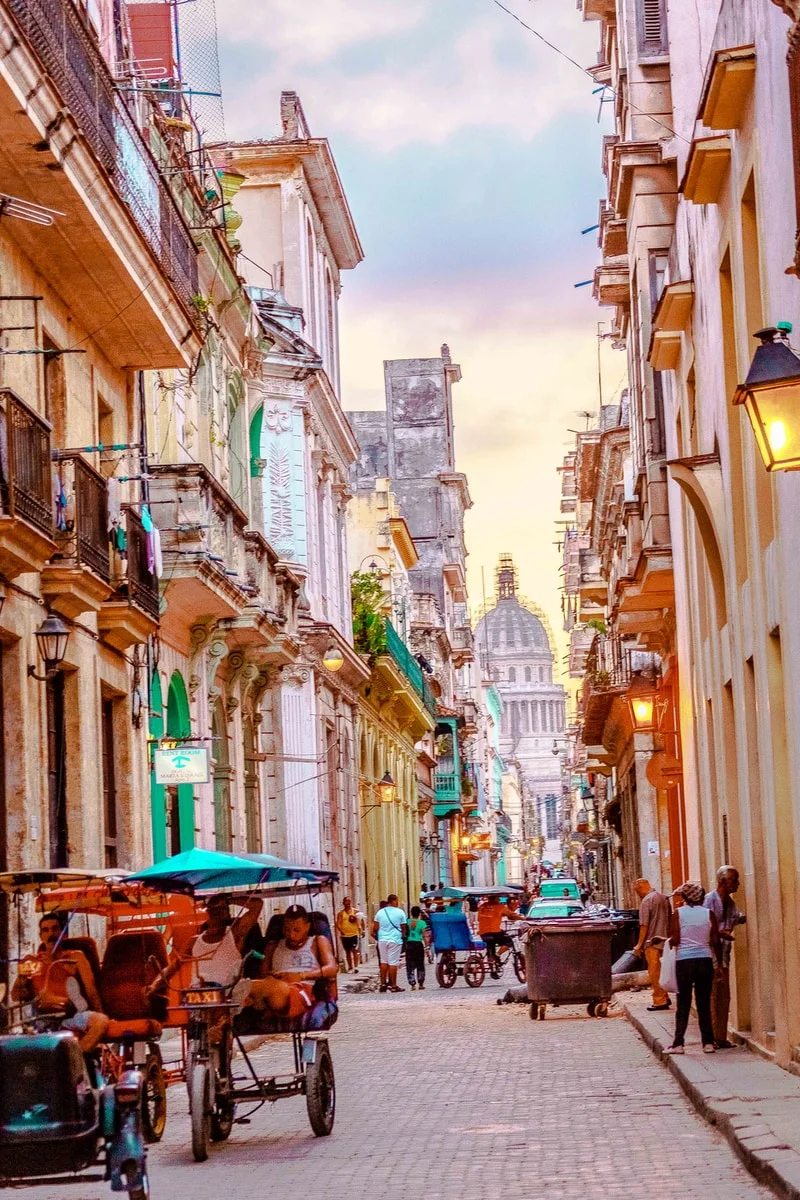 people walking on street between buildings during daytime